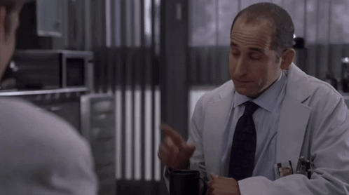 Man in Lab Coat with Smith Name Tag
