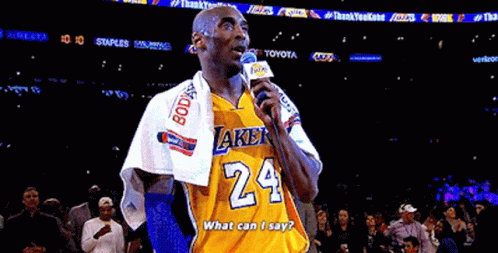 Man in Lakers Jersey Holding Microphone