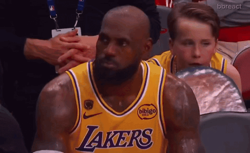 Man in Lakers Jersey Sitting