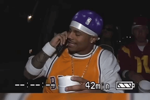 Man in Lakers Jersey Talking on Phone