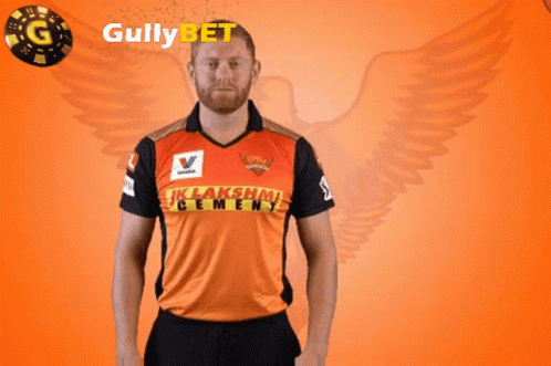 Man In Lakshmi Cement Shirt Holding Flower GIF