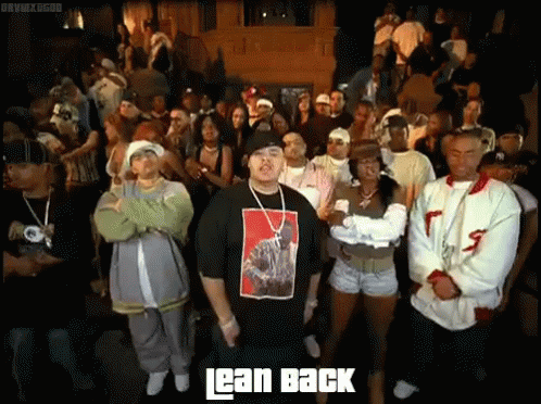 Man In Lean Back Shirt Standing Before Crowd GIF