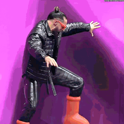 Man in Leather Jacket and Sunglasses on Pipe