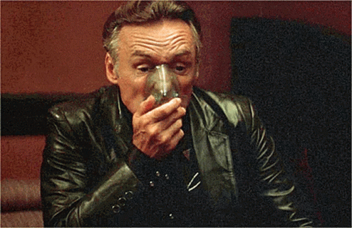 Man In Leather Jacket Holding Glass GIF