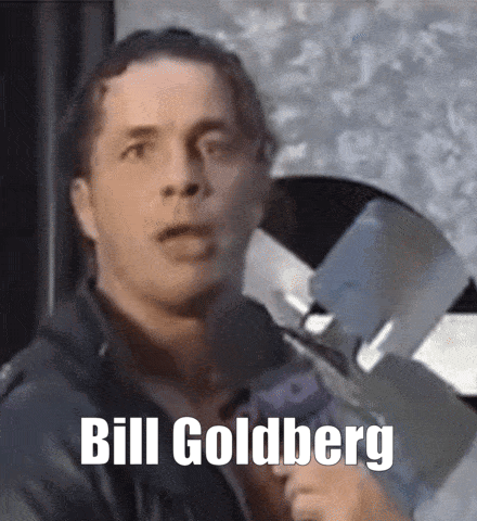 Man in Leather Jacket Holding Gun Says Bill Goldberg