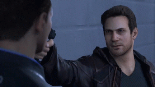 Man in Leather Jacket Holding Gun to Another Man