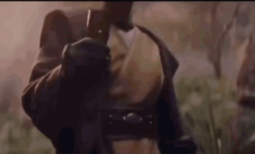 Man in Leather Jacket Holding Gun