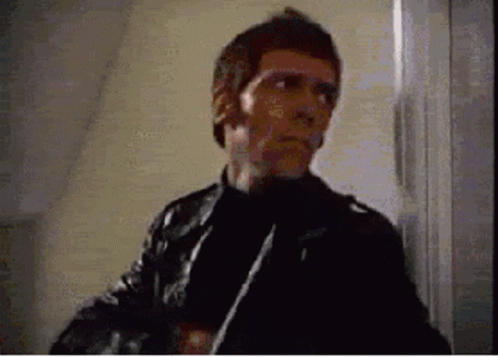 Man in Leather Jacket Holding Knife