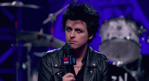 Man in Leather Jacket Holding Microphone