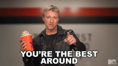 Man in Leather Jacket Holding Popcorn and Pointing