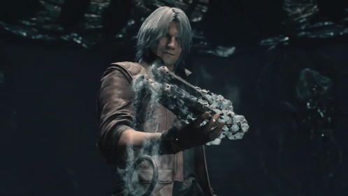 Man in Leather Jacket Holding Sword in Dark Room