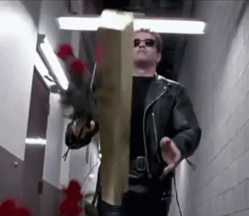 Man in Leather Jacket Holding Wooden Cross and Roses