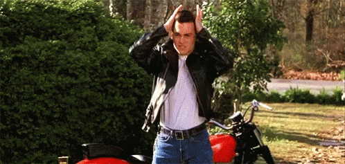 Man In Leather Jacket Next To Red Motorcycle GIF