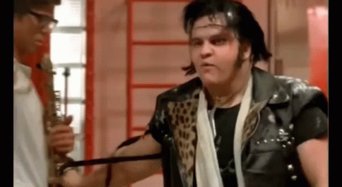 Man in Leather Jacket Next to Saxophonist