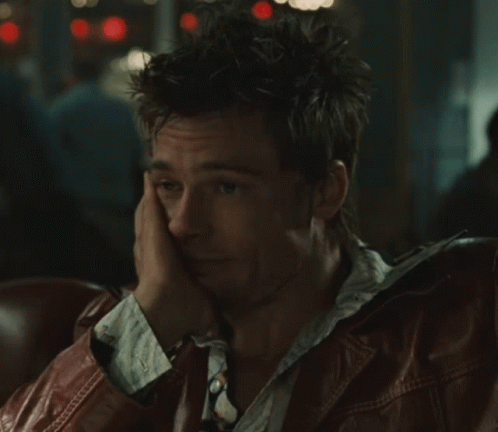 Man in Leather Jacket Sitting Hand on Face
