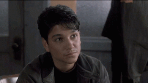 Man In Leather Jacket Talking To Another Man GIF
