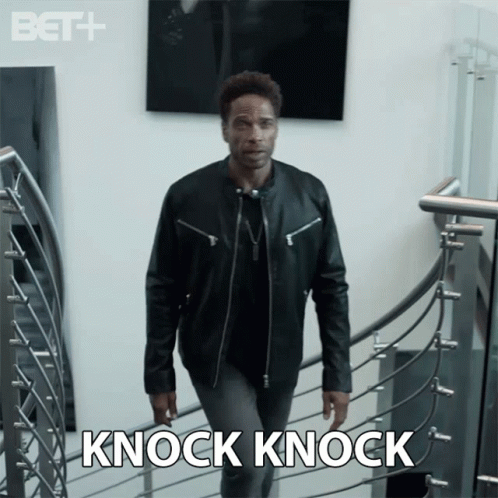 Man in Leather Jacket Walking Down Stairs