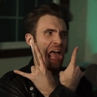 Man In Leather Jacket With Devil Horns And Tongue Out GIF