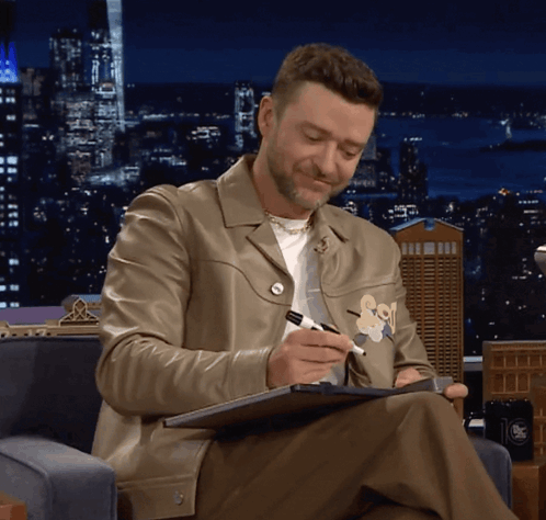 Man in Leather Jacket Writing