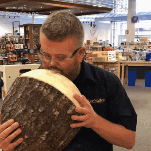 Man in Lee Valley Shirt Smelling Wood
