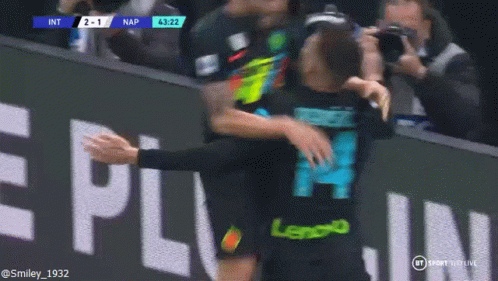 Man in Lenovo Jersey Hugging Another Man