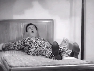 Man in Leopard Print Shirt Lying on Bed