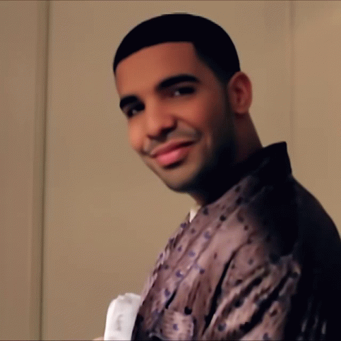 Man in Leopard Print Shirt Smiling at Camera