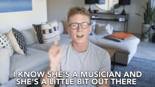 Man In Living Room Saying She's A Musician GIF