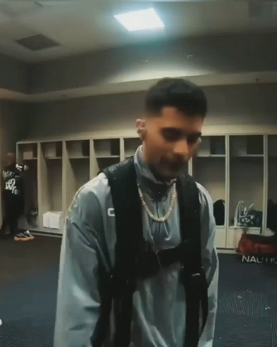 Man in Locker Room with C Sweatshirt