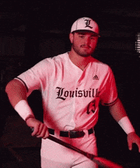 Man in Louisville Baseball Uniform Holding Bat