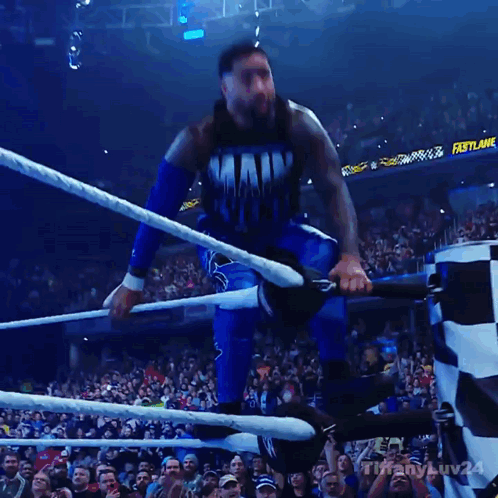 Man in Main Event Shirt Jumping Into Wrestling Ring