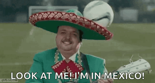 Man in Mariachi Outfit Holding Guitar and Soccer Ball