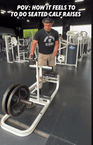 Man in Marine College Classic Shirt Doing Seated Calf Raises