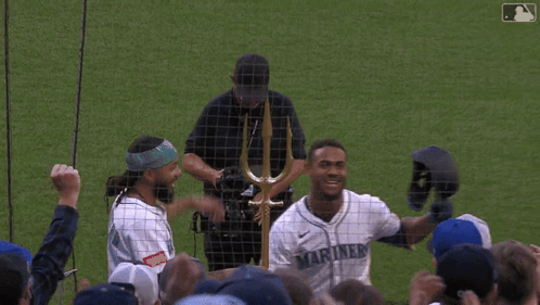 Man In Mariners Jersey Holding Helmet GIF