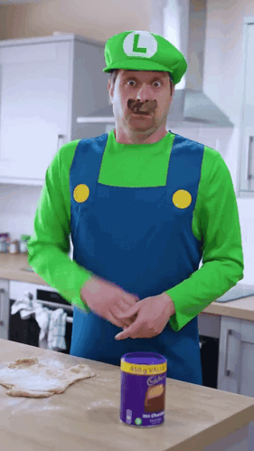 Man in Mario Costume Standing Near Cadbury Chocolate