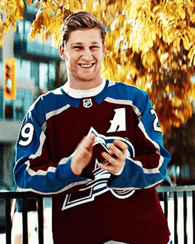 Man in Maroon and Blue Jersey Number 9