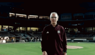 Man in Maroon Jacket With Letter M