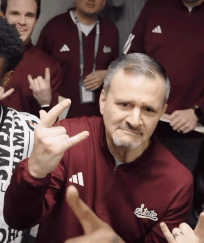 Man in Maroon Jacket with State