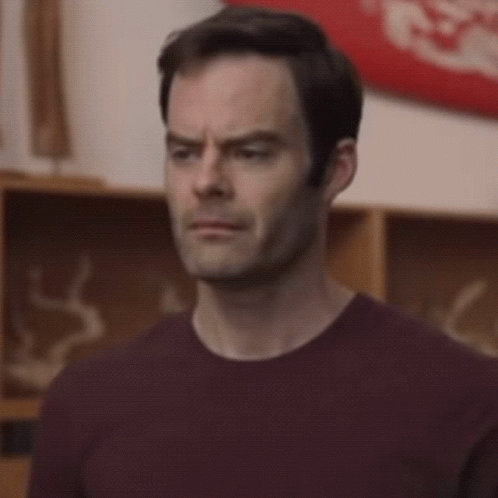 Man in Maroon Shirt Making Funny Face