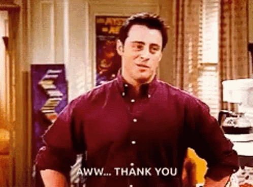 Man in Maroon Shirt Saying Thank You
