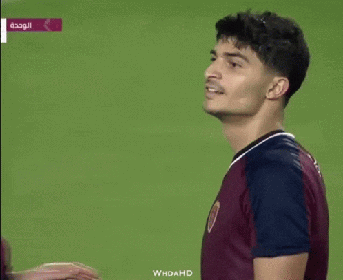 Man in Maroon Shirt Saying Whdahd