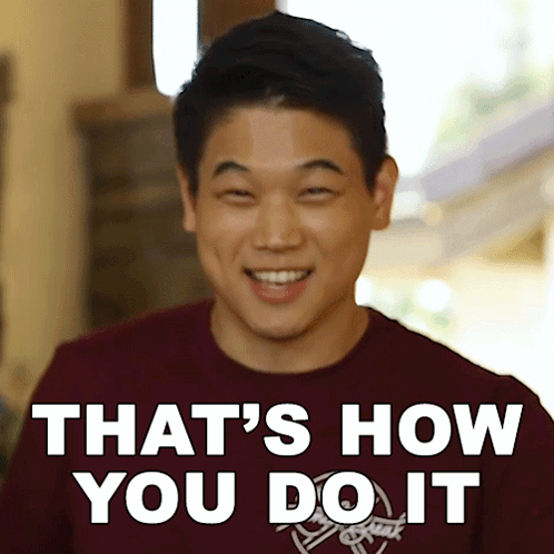 Man in Maroon Shirt Smiling