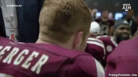 Man in Maroon Shirt With Name Roger on Back
