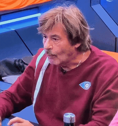 Man In Maroon Sweater With Blue Eye GIF