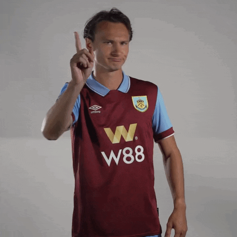 Man in Maroon W88 Jersey Pointing Up