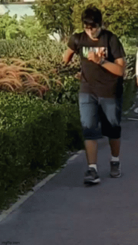 Man in Marvel T-Shirt Walking