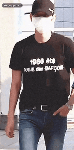 Man In Mask And Black T-Shirt Walking GIF