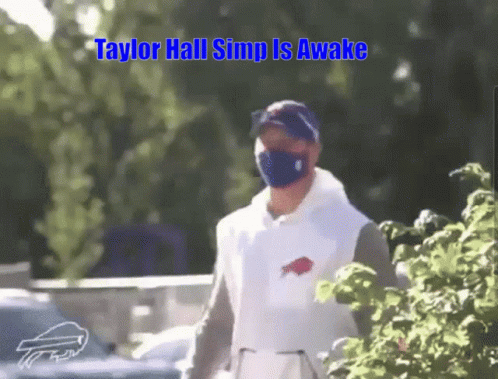 Man in Mask and Buffalo Bills Shirt Walking