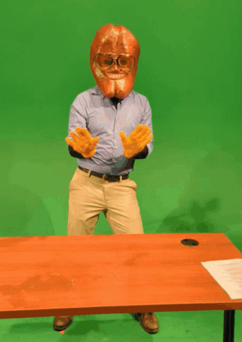 Man in Mask and Gloves at Desk