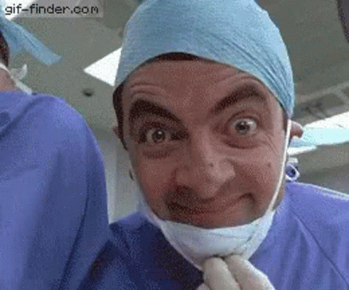 Man In Mask And Gloves Making Funny Face GIF